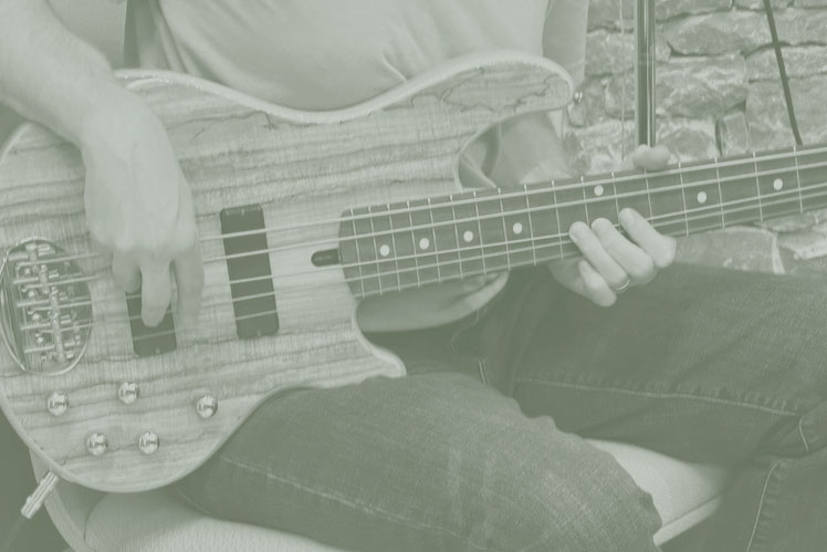Close-up of band member's bass guitar being played during service at Christ UMC.